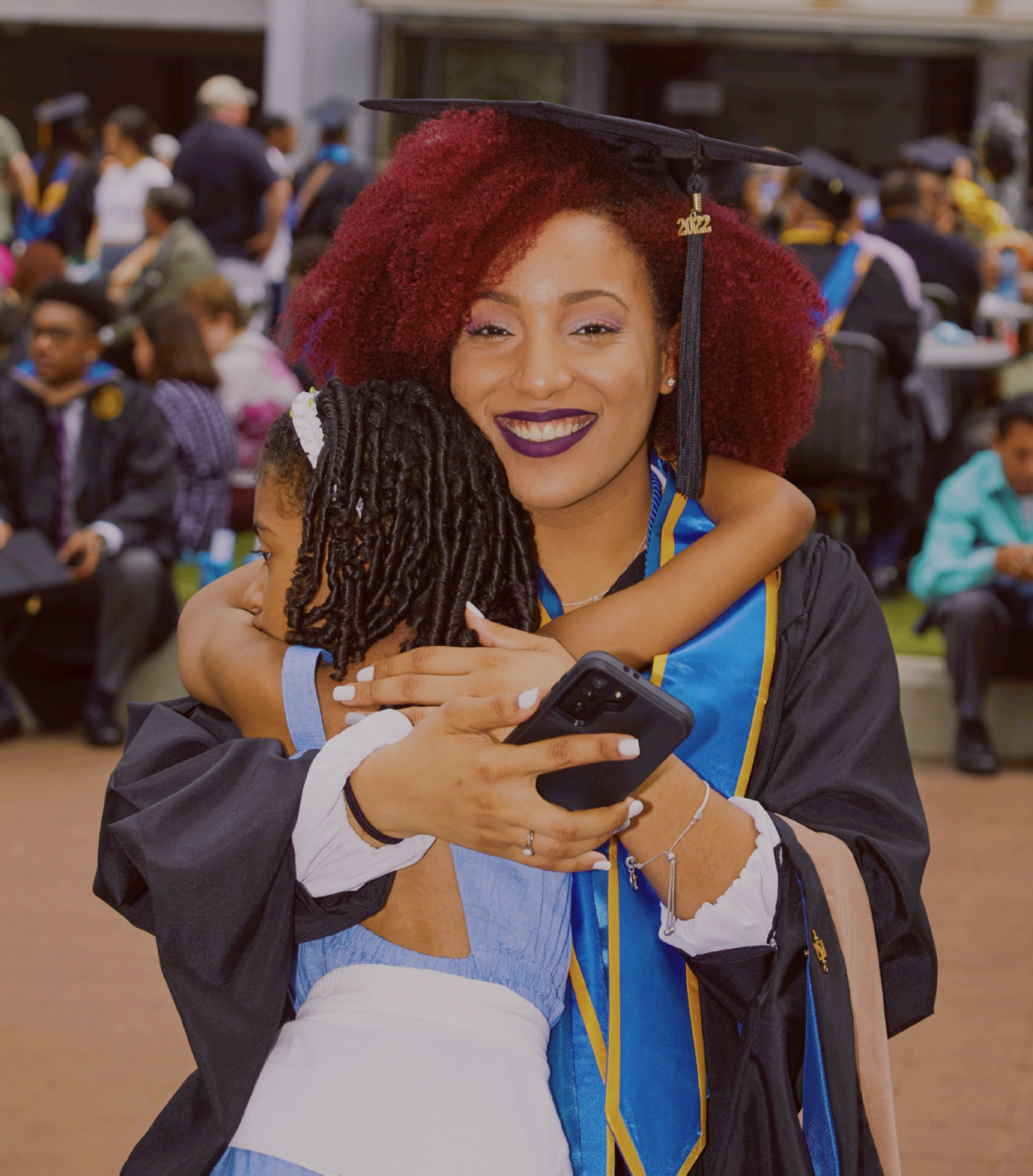 Anabelle in cap and gown, smiling.