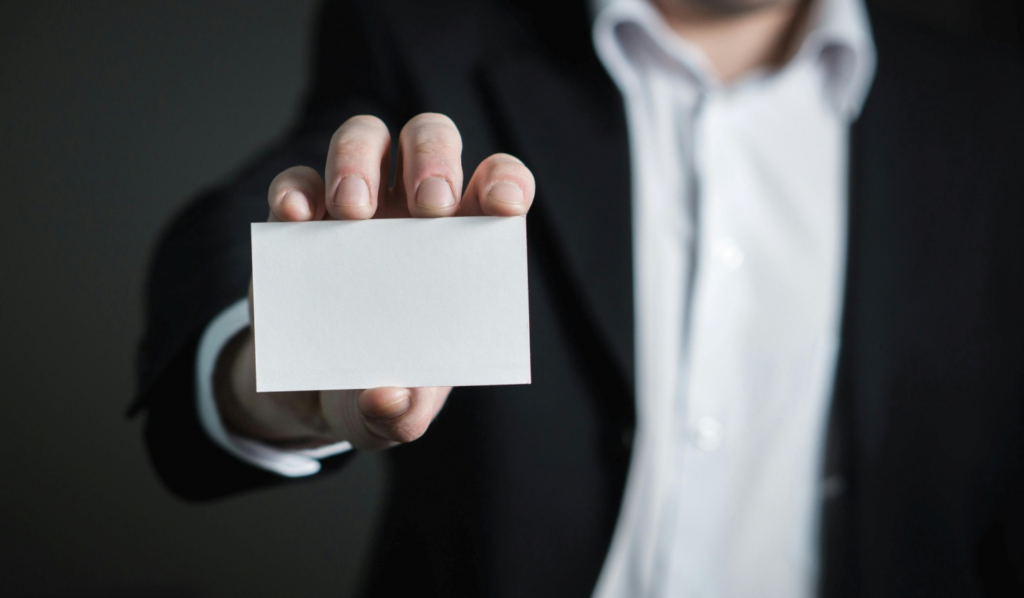 A person showing a blank card