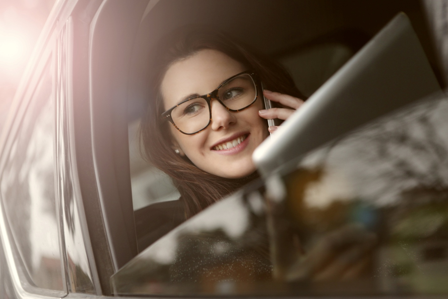 A woman talking on a phone