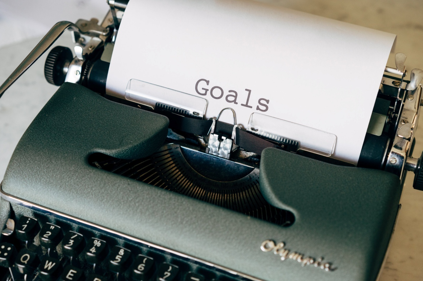 The word 'goals' printed on a piece of paper